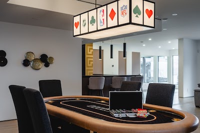 West Kelowna Airbnb interior with poker table and cards set up for play