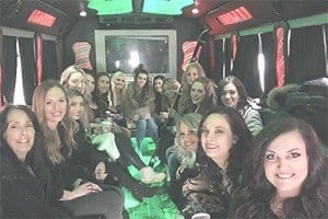 Bachelorette party in party bus smiling