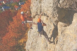 Person climbing outdoor rock course