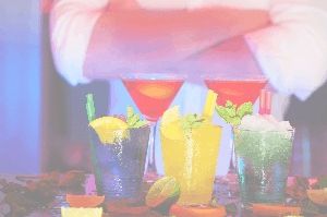 Colourful cocktails sitting on bar table