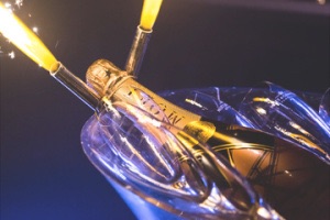 Close up of Moet bottle (champagne) with sparklers and champagne glasses in tub