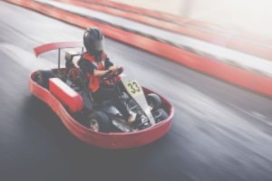 Red go-kart racing around track