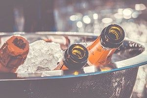 Close up of champagne bottles in ice bucket