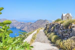 Looking down pathway on clifftop alongside Santorini Caldera