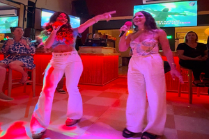 2 girls  doing karaoke
