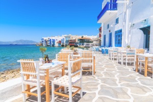 View of Little Venice, Mykonos from tables at waterfront restaurant.