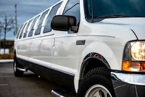 Close up of stretch limo van parked on road.