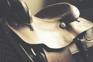 Close up of horse saddle in sepia tone