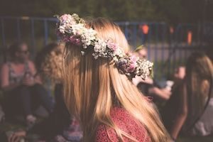 Women with blonde hair wearing colourful flower crown on head