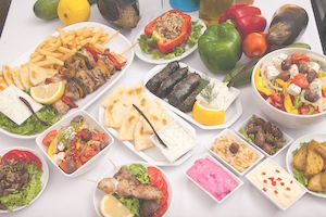 Table full of greek taverna delicacies
