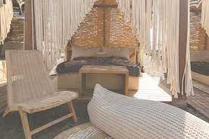 A luxury beach bed on a beach in Santorini Greece